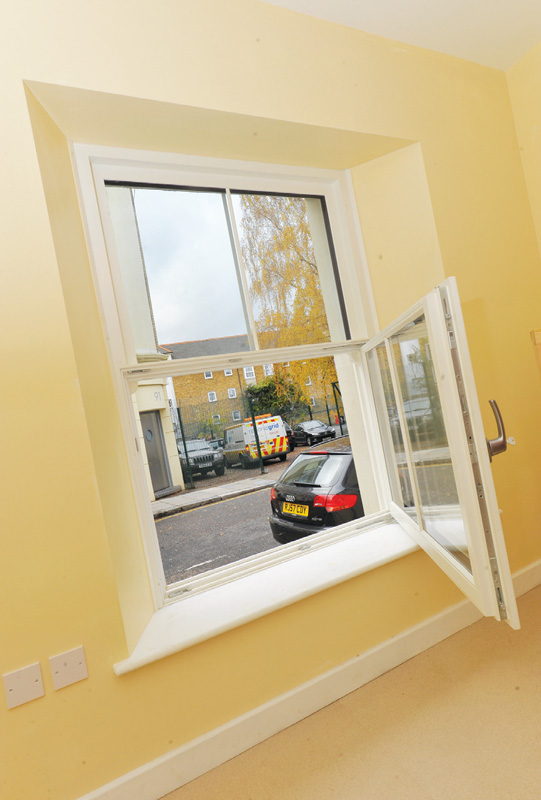 The team designed a triple-glazed, airtight imitation sash window with a fixed top pane and tilt-and-turn lower pane, along with custom made triple-glazed doors The team designed a triple-glazed, airtight imitation sash window with a fixed top pane and tilt-and-turn lower pane, along with custom made triple-glazed doors