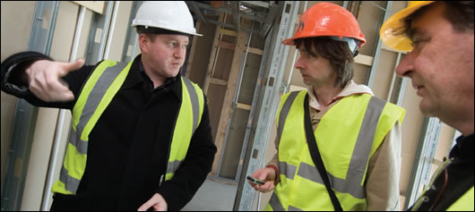 Explaining the Building Intricacies Diarmuid Hynes (left) and David Heffernan, founder of HAA (right) explaining the intricacies of the building to Construct Ireland's John Hearne (centre)