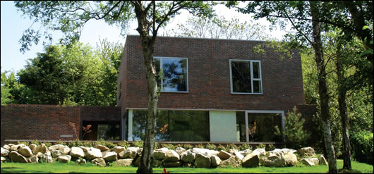 Making full use of the site's mature woodland was an important aspect of the design brief. Large windows on this rear elevation overlook the garden and wooded area out to the Wicklow mountains Making full use of the site's mature woodland was an important aspect of the design brief. Large windows on this rear elevation overlook the garden and wooded area out to the Wicklow mountains