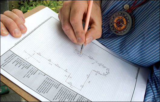 Stephen Harte drawing a map of the house: note the compass for checking orientation Stephen Harte drawing a map of the house: note the compass for checking orientation