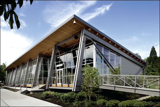 The Pavilion in the Park at South Lake Union, Seattle separates at three integrated joints to break into four separate modules. The building sits lightly atop short concrete piers allowing the grade and vegetation to run uninterrupted beneath. Gangway ramps with integrated hinged joints can adapt to the topography of future locations The Pavilion in the Park at South Lake Union, Seattle separates at three integrated joints to break into four separate modules. The building sits lightly atop short concrete piers allowing the grade and vegetation to run uninterrupted beneath. Gangway ramps with integrated hinged joints can adapt to the topography of future locations