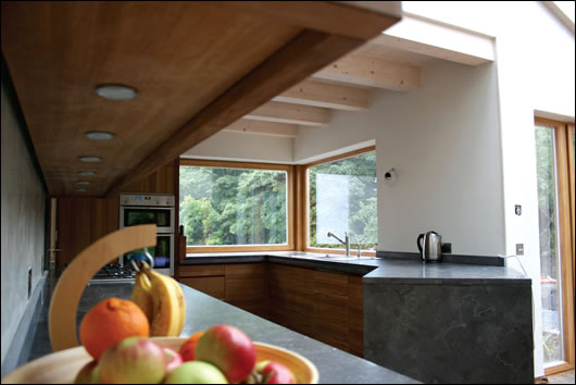 open plan design and glazing bring natural light into the kitchen open plan design and glazing bring natural light into the kitchen
