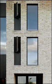 The new buildings are fitted with double-glazed windows that boast a U-value of 1.5 W/m2K for the overall unit. Glazed sections cannot be opened, but accompanying timber panels can The new buildings are fitted with double-glazed windows that boast a U-value of 1.5 W/m2K for the overall unit. Glazed sections cannot be opened, but accompanying timber panels can